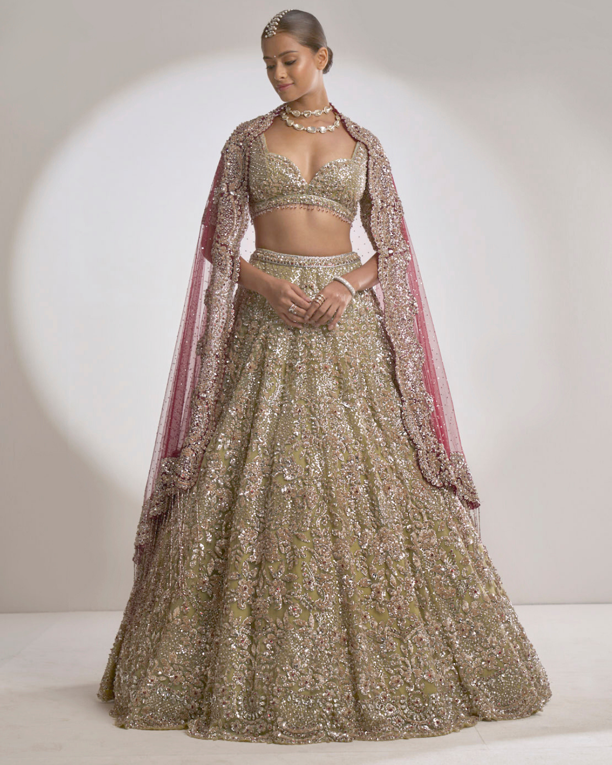 Green and 2025 gold bridal lehenga