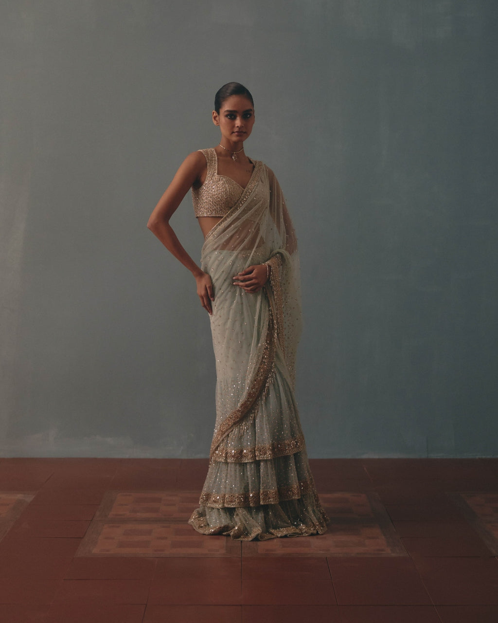 Ice Blue And Rose Gold Hand Embroidered Net Sari And Sleeveless  Blouse