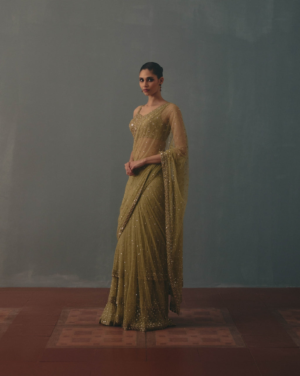 Sage Green And Pani Gold Hand Embroidered Net Sari And Sleeveless  Blouse