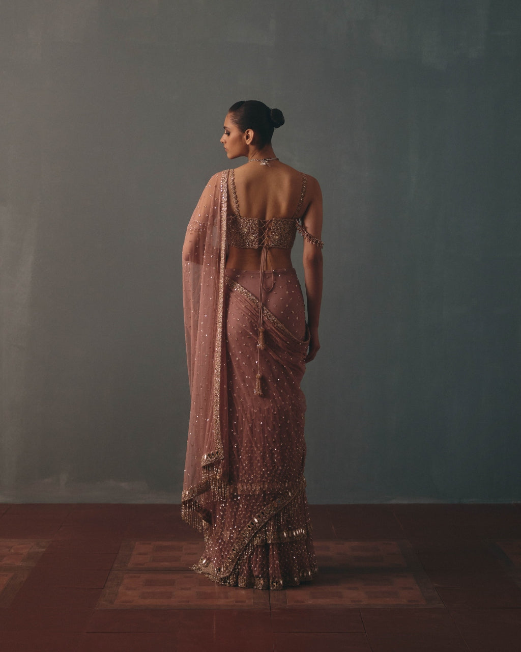 Mauve & Rose Gold Hand Embroidered Net & Mirror Corset & Net Ruffle Sari Set