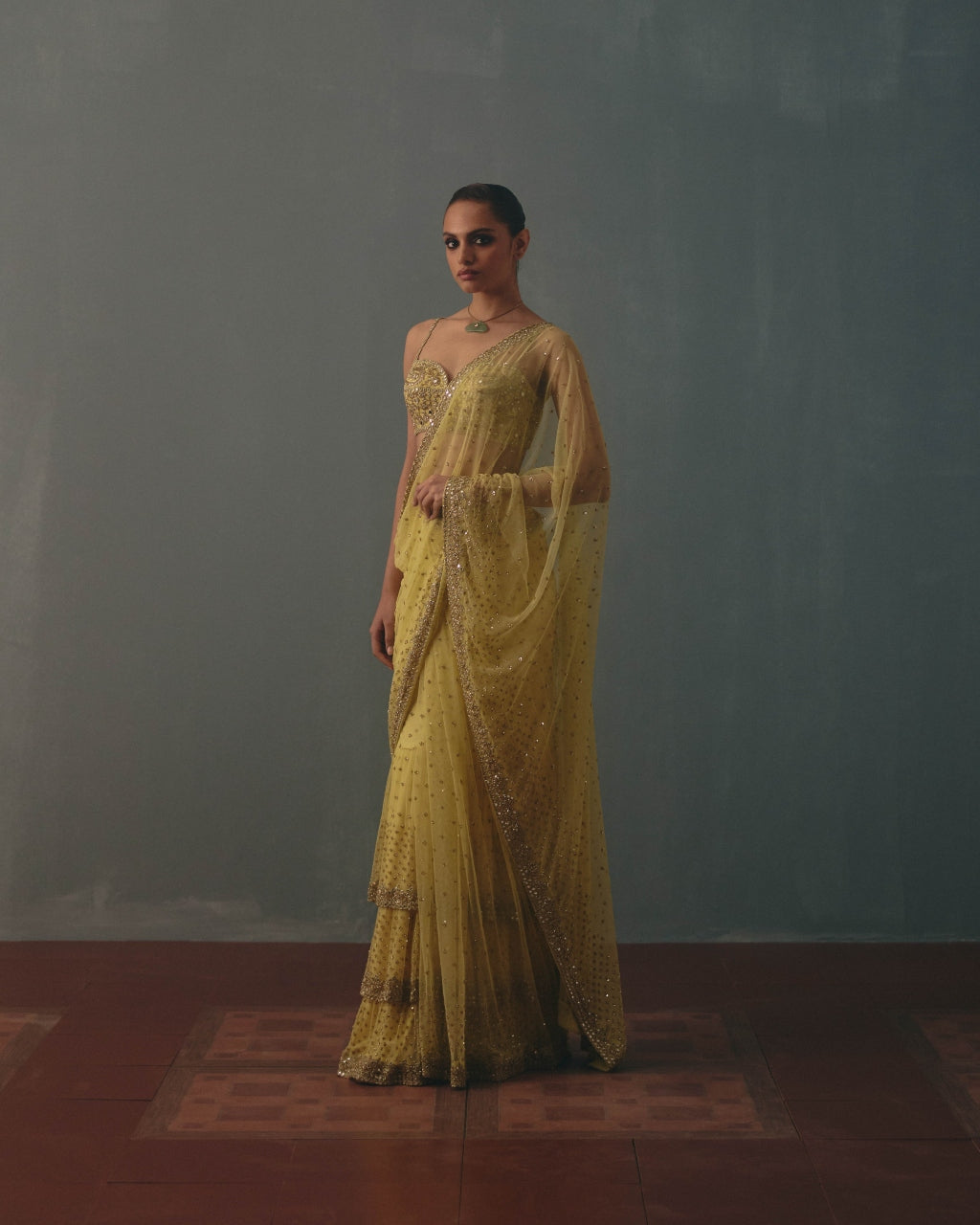 Butter Yellow And Pani Gold Hand Embroidered Net & Mirror Blouse & Net Ruffle Sari Set