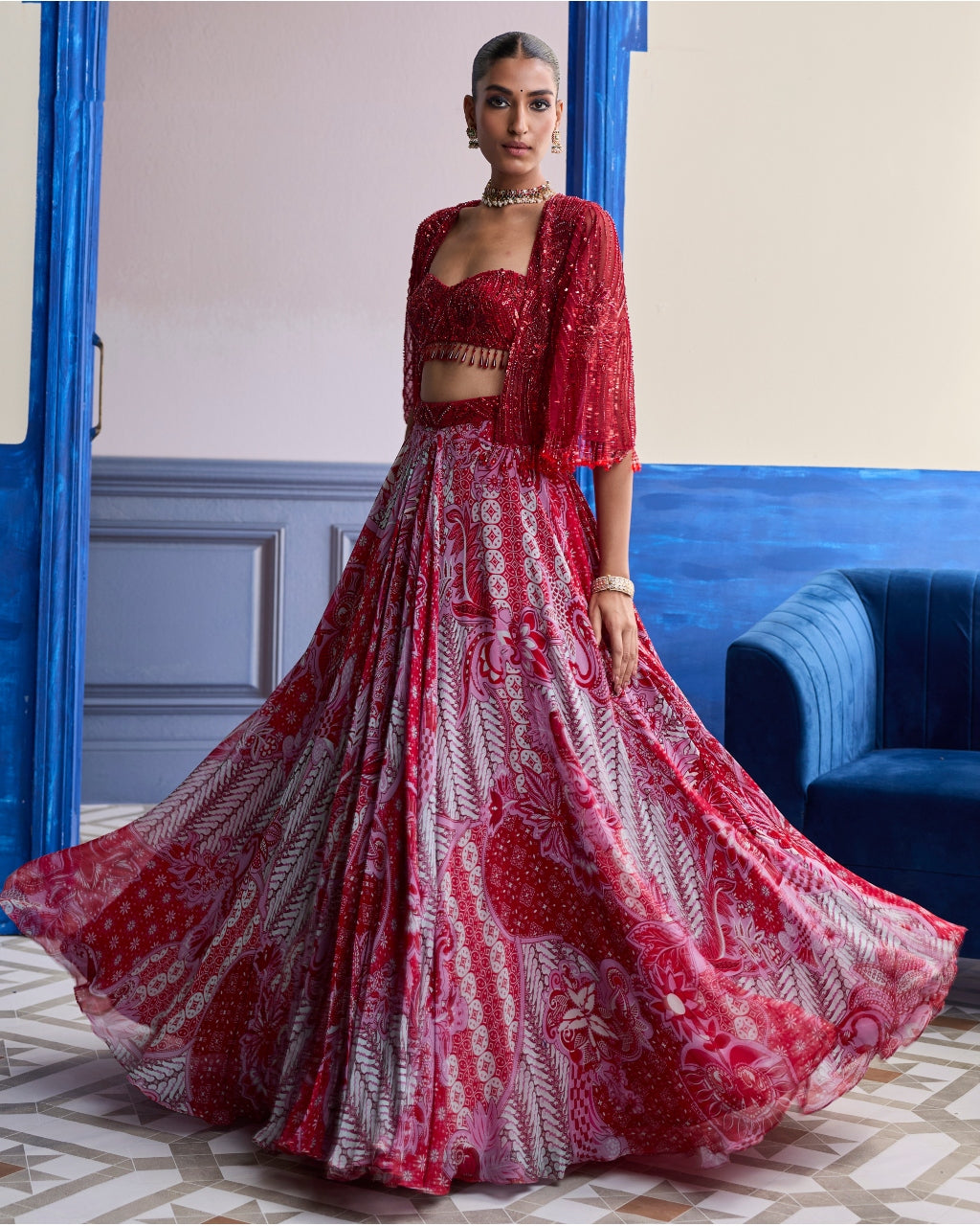 Red Embroidered Blouse With Tassel Cape Jacket & Floral Lehenga Set