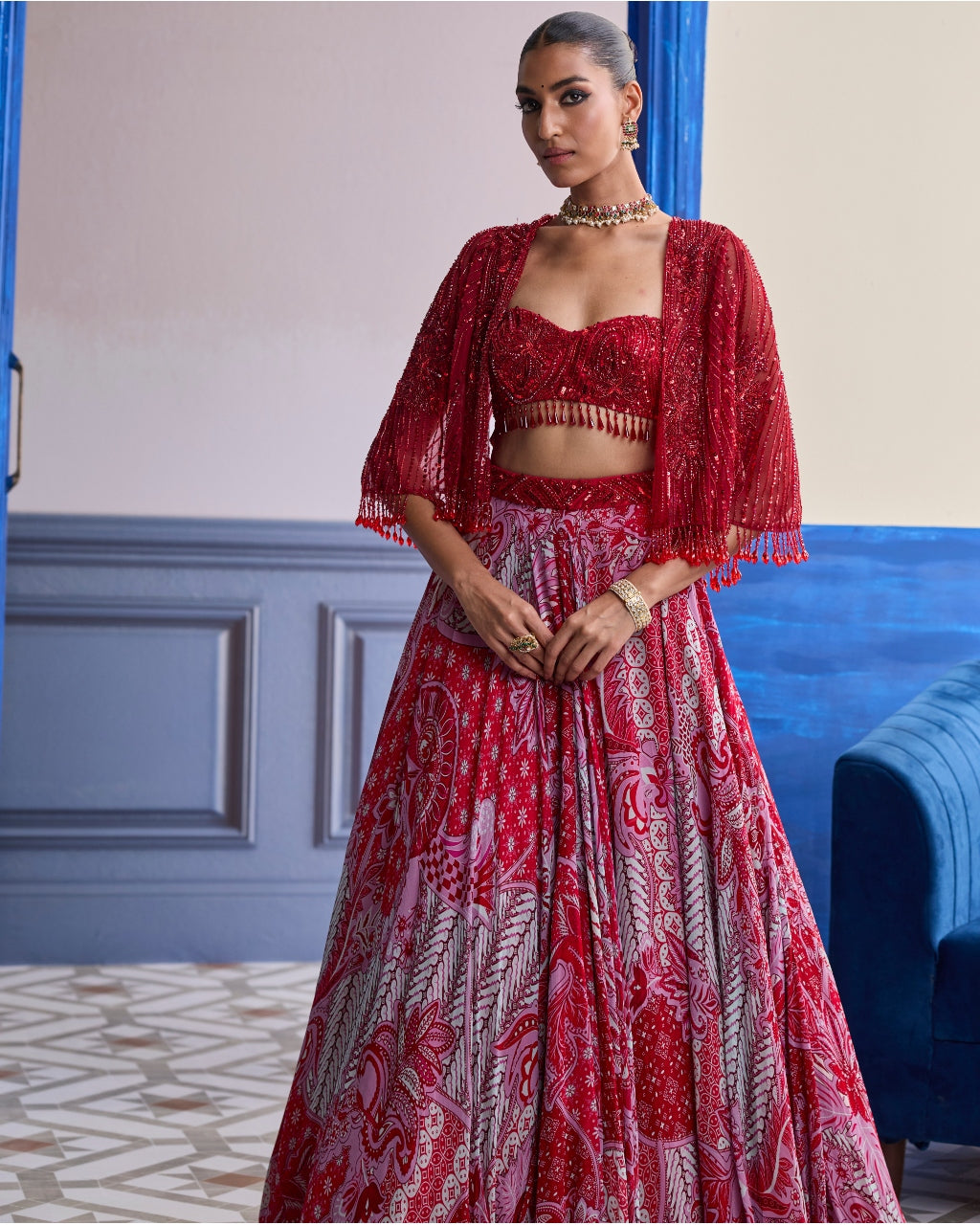 Red Embroidered Blouse With Tassel Cape Jacket & Floral Lehenga Set