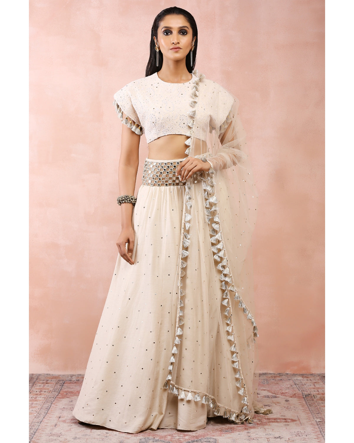 Cream Top With Embroidered Belt Lehenga And Dupatta by Payal Singhal