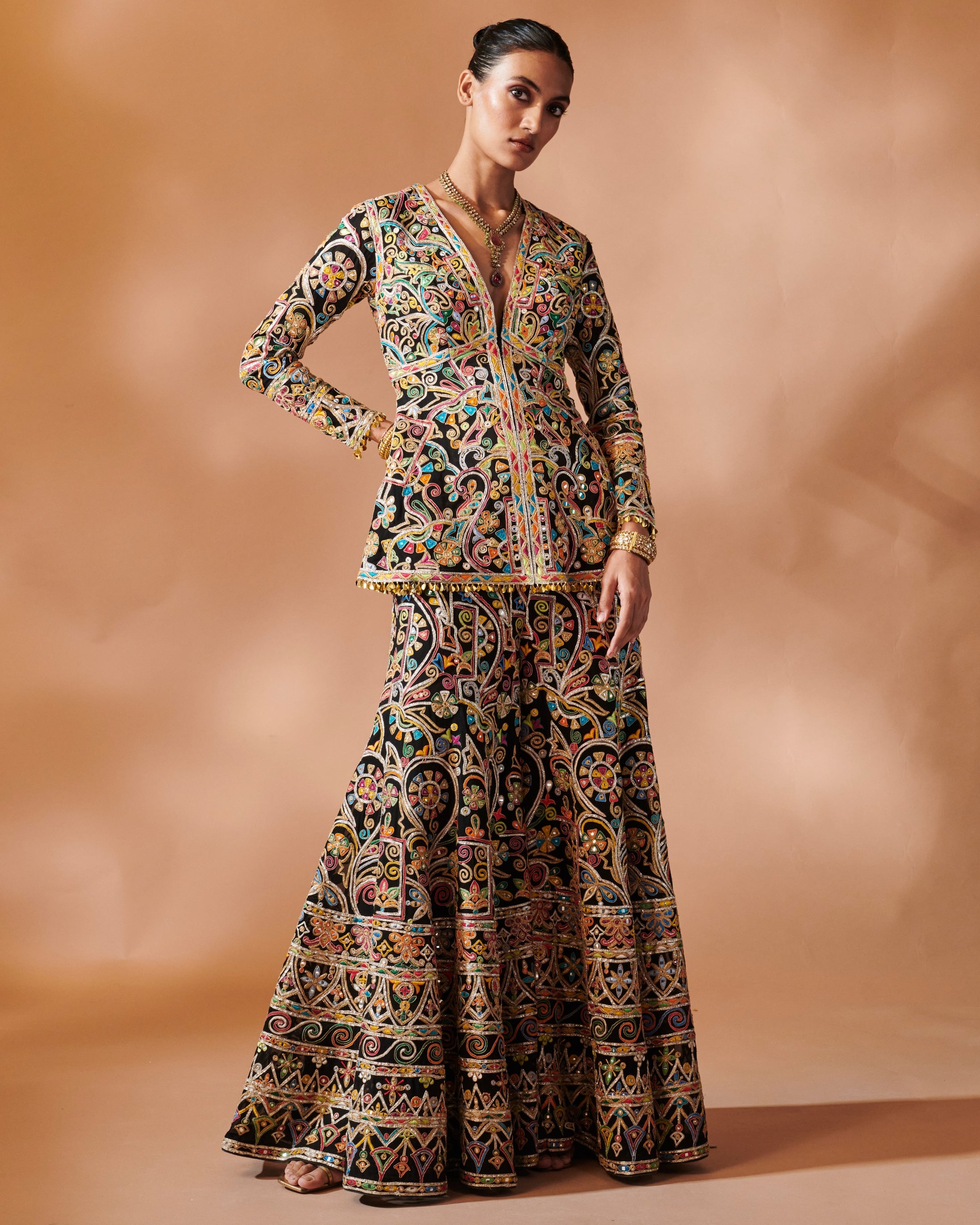 Azra Black Sharara With A Peplum Kurta