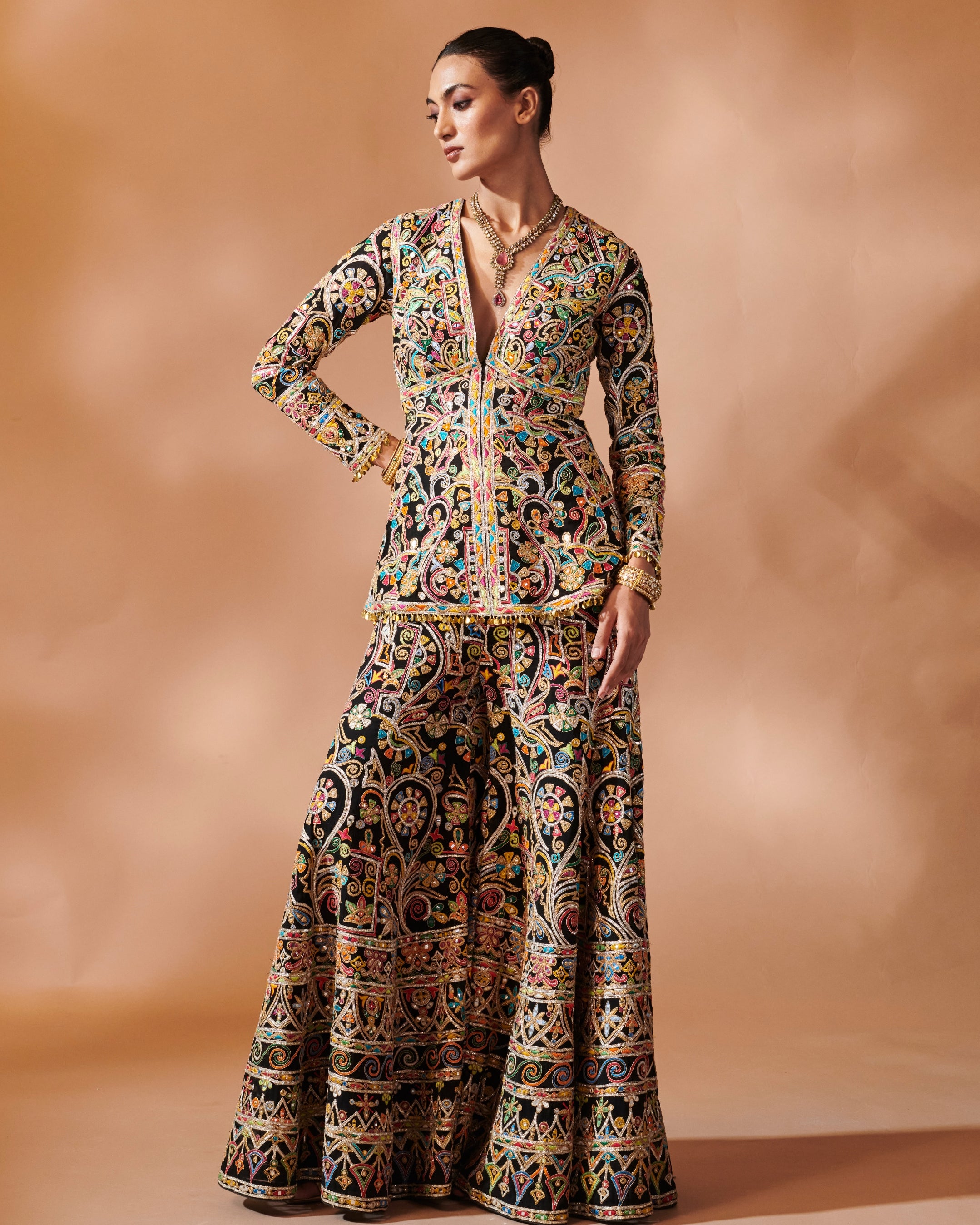 Azra Black Sharara With A Peplum Kurta