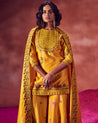 Yellow Short Kurti With Sharara & Dupatta by Punit Balana