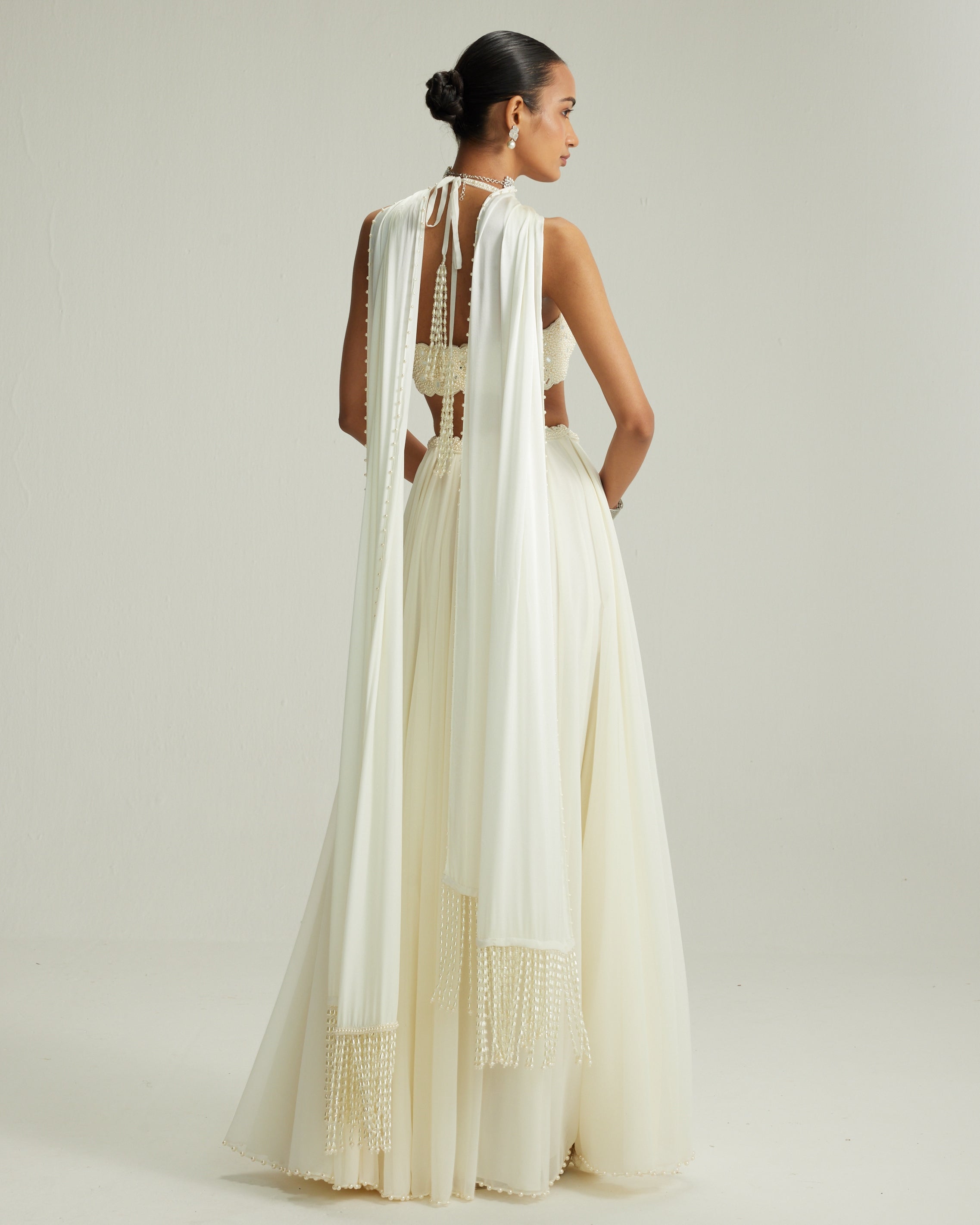 Off White Skirt Set With Halter Neck Blouse