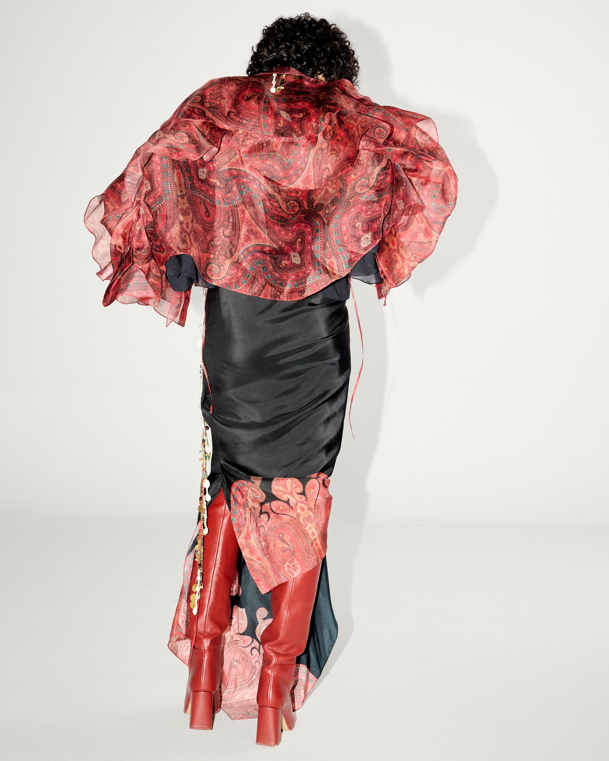 red audrey dress AUDREY is a dress made for unforgettable entrances Crafted in red velvet, this mini silhouette features a transformable shoulder line, a sensual slit, and delicate bow accents, embodying the essence of evening