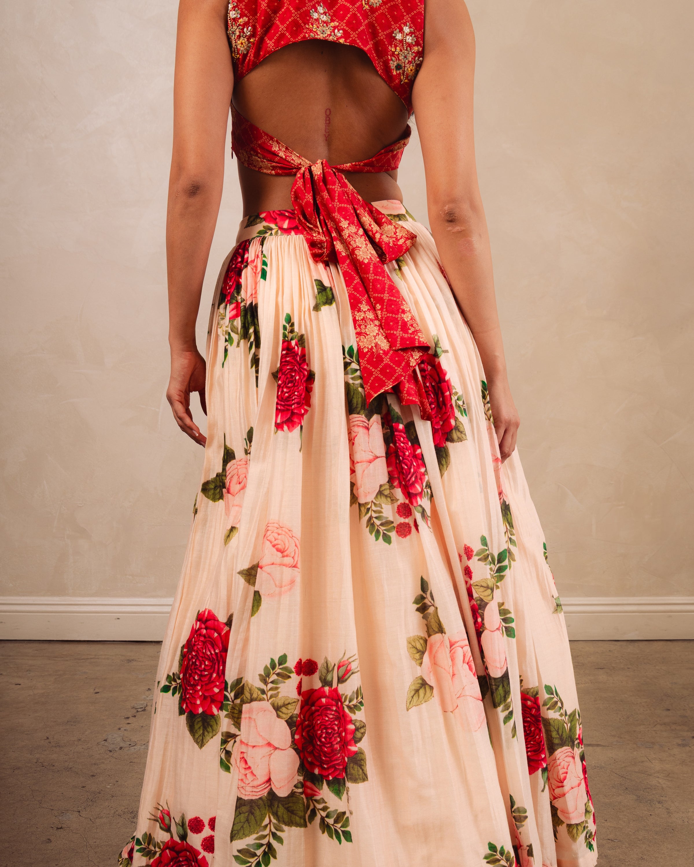 Red Printed Crop Top And A Peach Printed Skirt