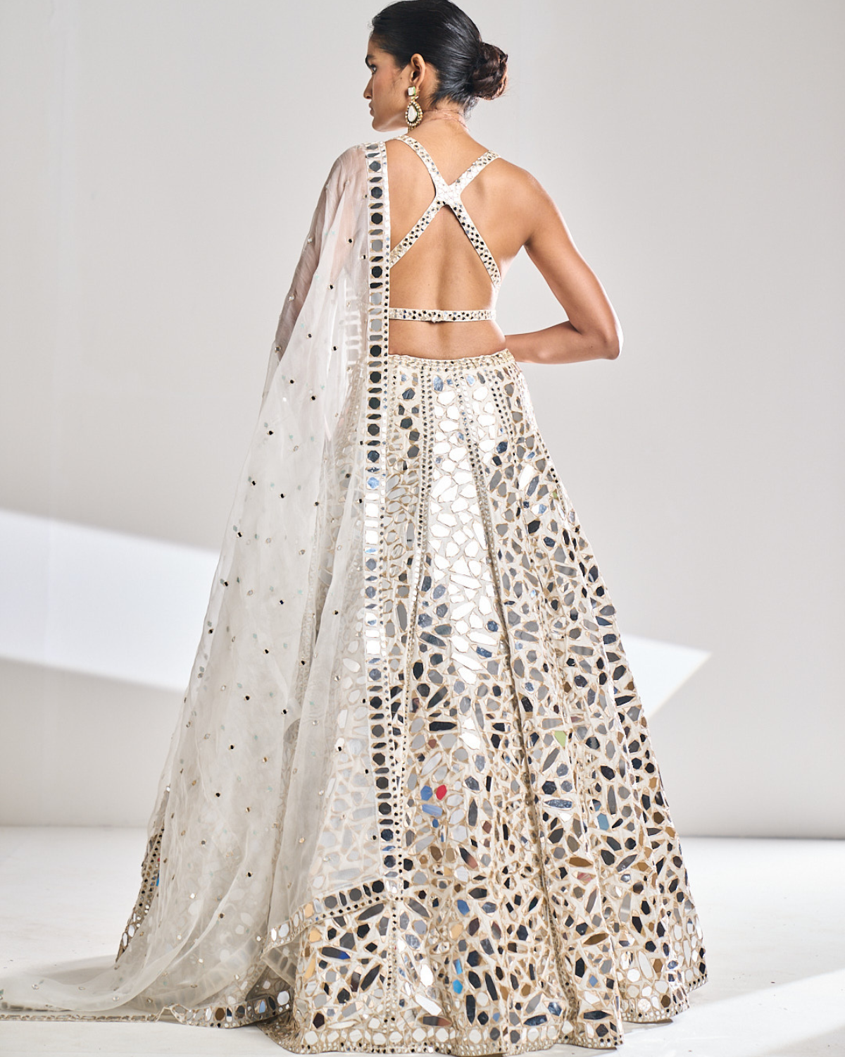 DUSTY BROWN CLASSIC LEHENGA SET WITH ALL OVER IVORY PATTERNED EMBROIDERY  PAIRED WITH A MATCHING DUPATTA AND SILVER AND IVORY HAND EMBROIDERED  DETAILS. - Seasons India