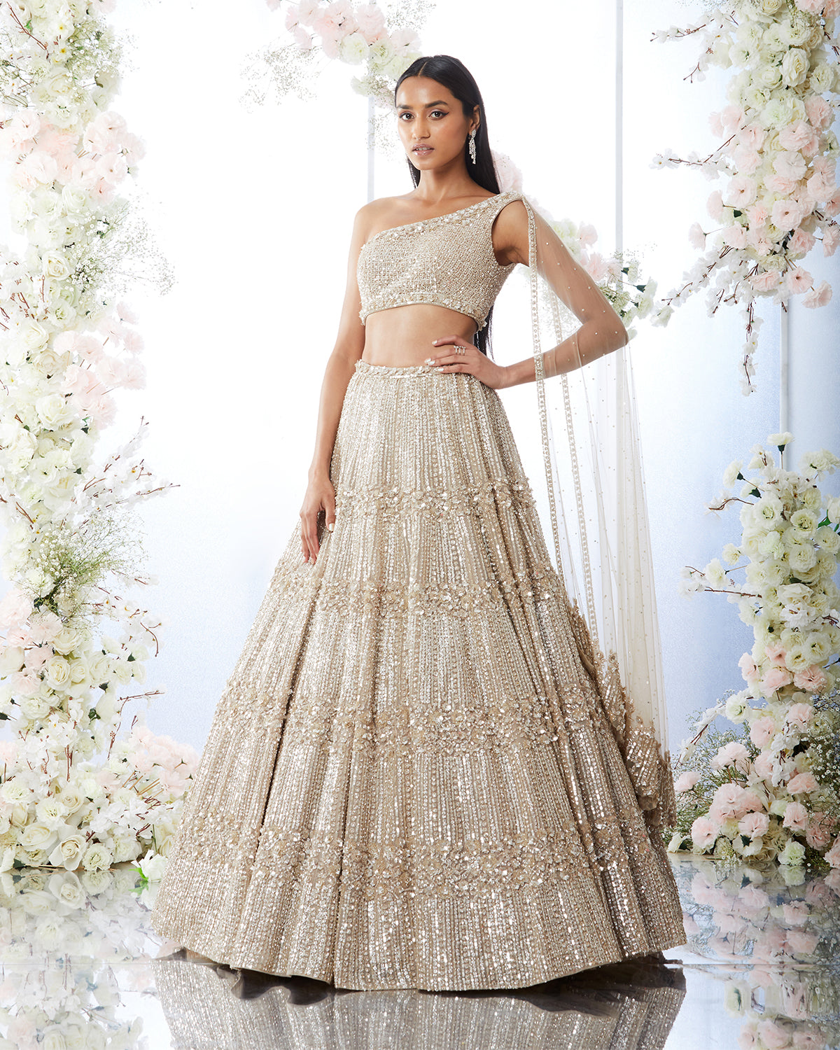 One Shoulder Champagne Lehenga with Platinum Cut Sequins by Seema Gujral at KYNAH