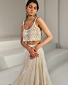 Ivory Embroidered Lehenga with Gold Blouse by Ritika Mirchandani at KYNAH