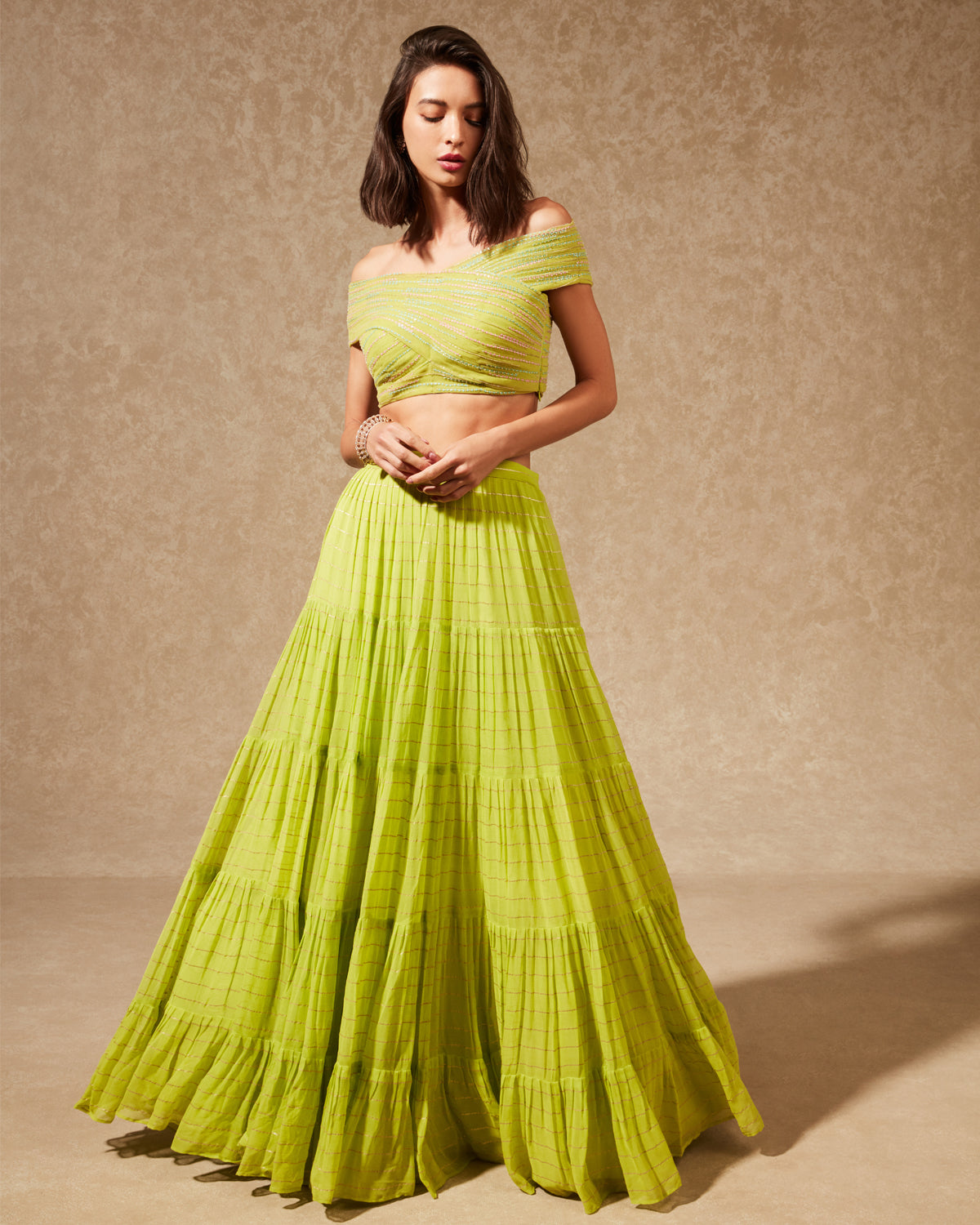 Green Tiered Skirt and Off Shoulder Blouse Set by Chamee and Palak at KYNAH