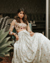 Nude Embroidered Blouse and Mint Green Brocade Lehenga by The Little Black Bow